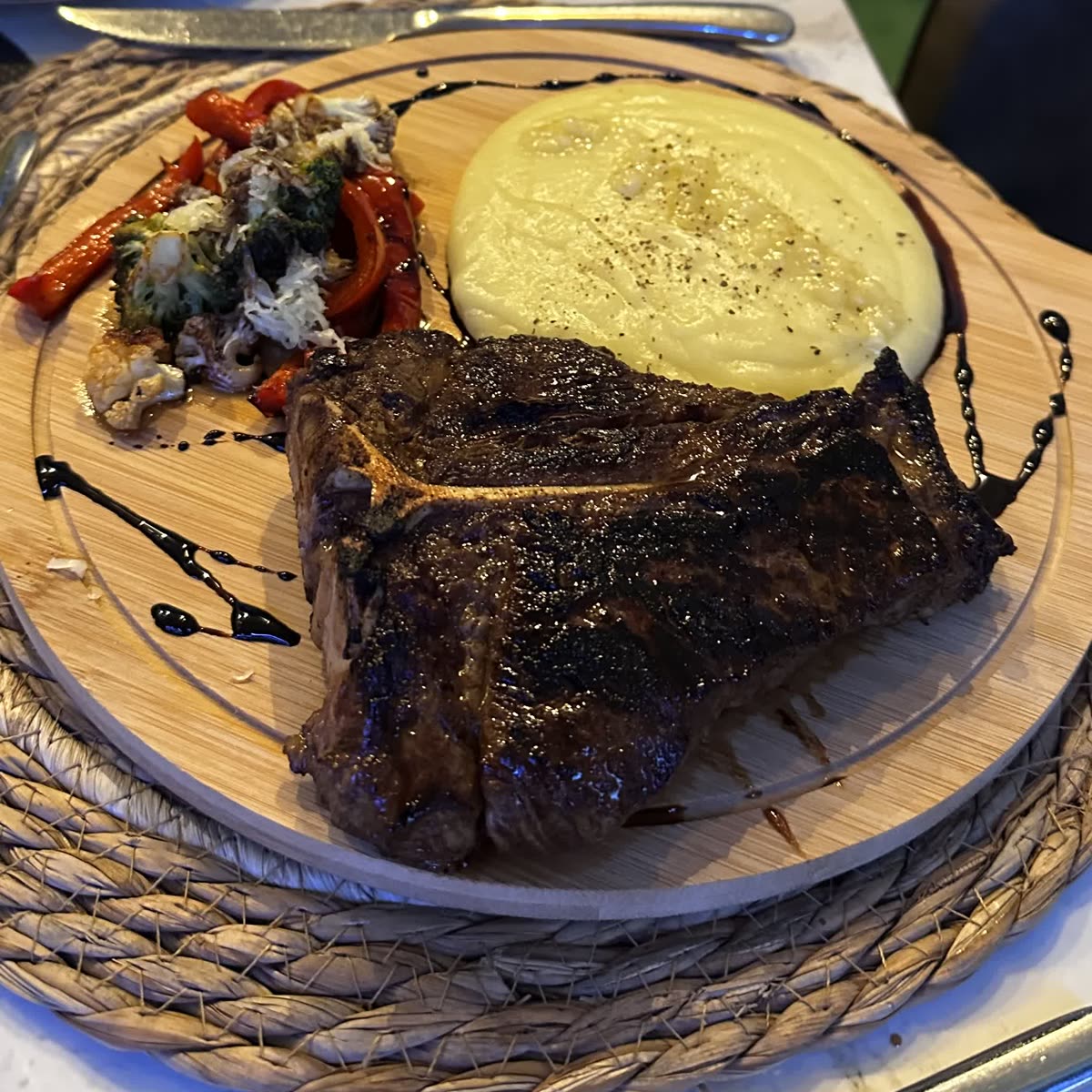 Grilled steak with mash and roasted vegetables